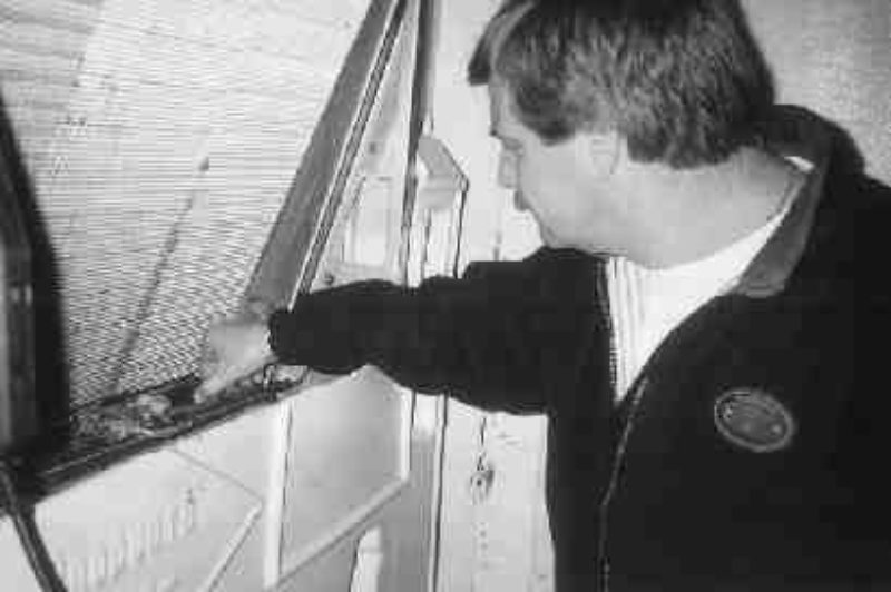 A DIRTY JOB: Cleaning the reefer's heat exchanger often will reduce the risk of enroute failure and the resulting food spoilage. (Photo by Matthew Sylvain)