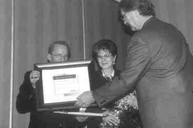 SUPER TRUCKER: A modest Eldon Johnson shies away from publicity as he is presented with his award by AMTA's Lane Kranenburg.(Photo by James Menzies)