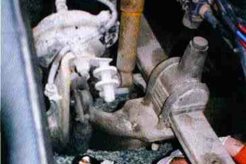 CREEP SHOW: Truck enforcement officer Tony Leitao searches for defects at the Essex South station during RoadCheck 2001. This particular truck passed the inspection with flying colors.