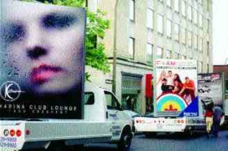 ADDING AND SUBTRACTION: City council may try to ban the rolling billboards later this year.