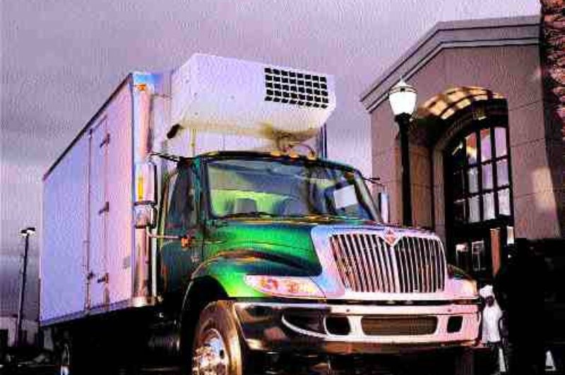 EVOLUTION OR REVOLUTION: Medium-duty trucks like the International 4000-Series High Performance rig on the left, have come a long way since the days when old binders, like the one on the right, helped bushwhack the northern reaches of Canada.