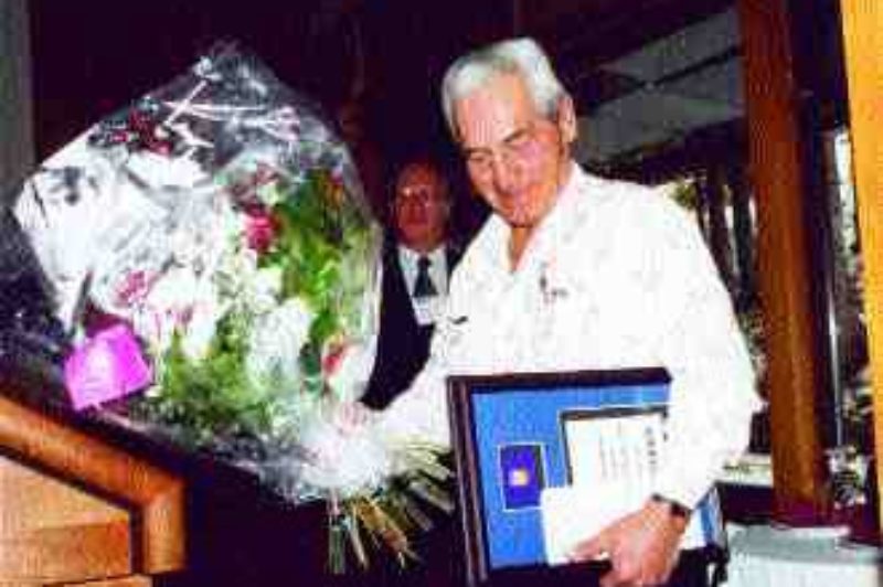 FLATTERED: Alberta Driver of the Year, Victor Lachance, accepts his award as Volvo Truck Canada's Robin Ross looks on.Photo by James Menzies