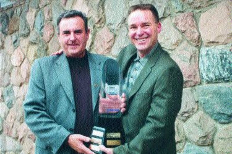 TOP WRENCH: Ed Roeder (right) receives the 2003 Maintenance Manager of the Year award, and congratulations from last year's winner, Bill Dinino (left).