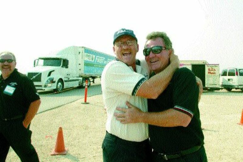 NATIONAL WINNER: Dwight Fisher, with SLH Transport, gives Peter Bergin - SLH Transport president a huge hug after competing in the Five-axle/Tandem Tandem Class category at the 2003 National Professional Truck Driving Championships held in Winnipeg Sept.6. Fisher was also the Grand Champion.