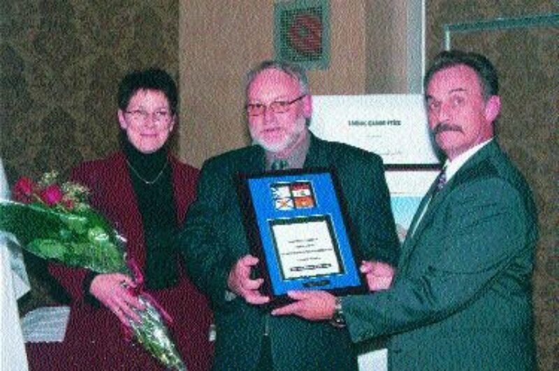 CONGRATS: Volvo Trucks Canada representative, Ted Booth, presents the Driver of the Year award to Georges and Jocelyne Leblanc. Photo by Katy de Vries
