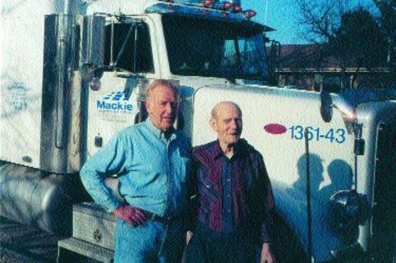 OLD FRIENDS: Ross Mackie (left) visited with former trucker Rudy Croissant.