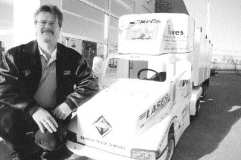 EDUCATING: Teaching kids about safety around the big rigs is what this made-to-scale electrically powered tractor-trailer is designed to do. Donated by the Windsor Transportation Club, and paid for though advertising by WTC members including carriers and shippers, it promotes child safety and awareness around the big rigs in the real world, especially in Windsor where 10,000-plus trucks per day come through the city. According to Doug Fitzpatrick (pictured above) Chair of the WTC's 18 Wheels for Safety campaign and sales and marketing regional manager at Laser Transport Inc., too often truckers 