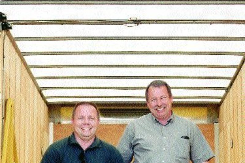 TRUCKIN' TWOSOME: Brothers Andy (left) and Dave spec' to haul and haul to spec' in trailers they design themselves. Photo by Ingrid Phaneuf