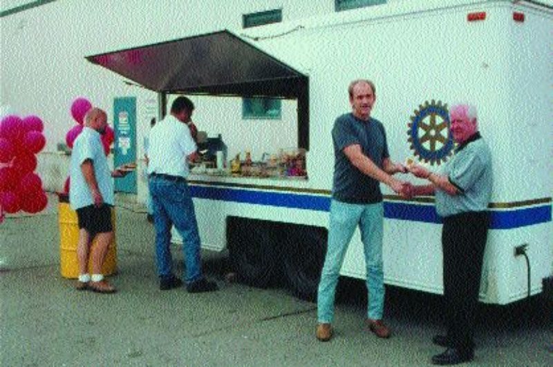 THANK YOU: George Ledson, president of Cavalier Transport thanks driver, Leonard Luttrell at a National Trucking Week BBQ at the Bolton terminal.