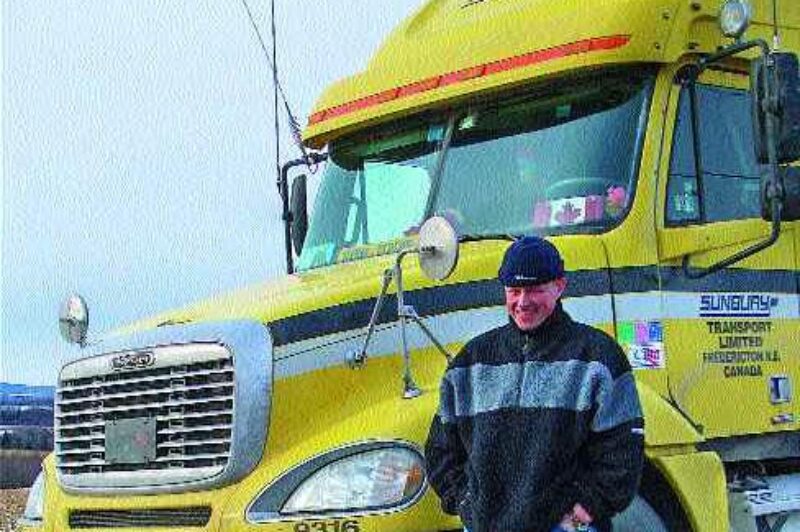 HAPPY IN CANADA: Dutch truck driver Harm Meulman says he loves his new life on Canada's highways. Photo by Annette Sluiter