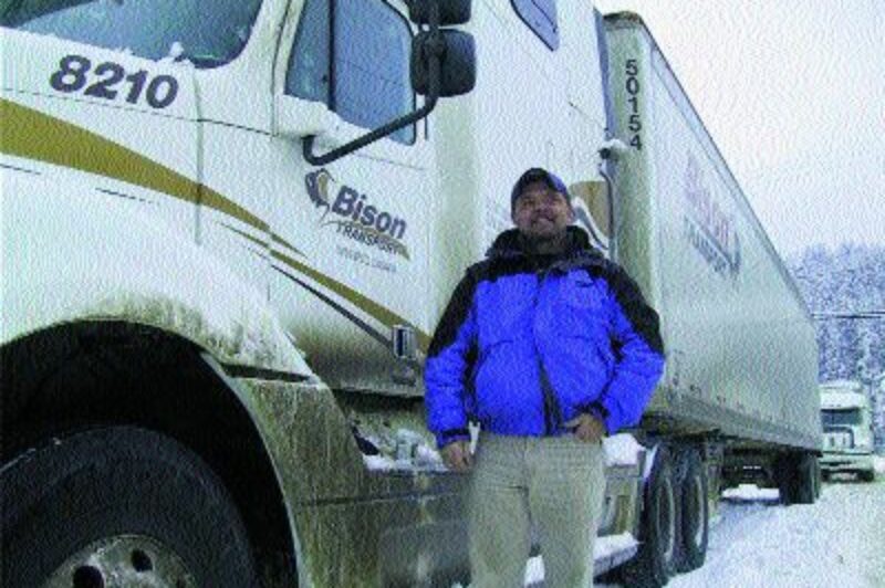 STRANDED: Bison Transport driver, Norman Monkman, opted to rent a room rather than keep his truck idling for days at a time.
