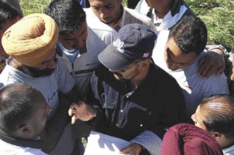 POWER HUDDLE: Protesting truckers in the GTA gather to discuss their position during the recent GTA cartage strike.