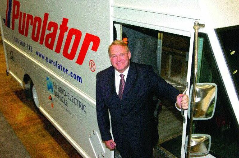 COSTLY TECHNOLOGY: Robert Johnson, president and CEO of Purolator shows off one of the company's hybrid delivery trucks.