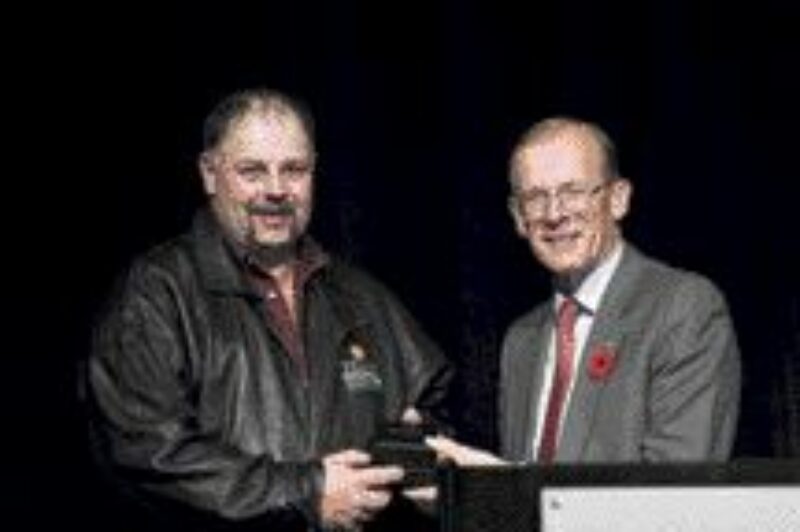 CONGRATS: Stephen Large is rewarded by Shell Canada CEO, Clive Mather.