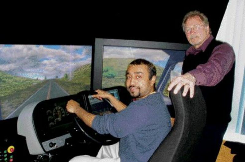 JUST LIKE REAL: Sagar Shetye (left) and Alan Masters of DriveWise demonstrate the realism of today's truck simulators.