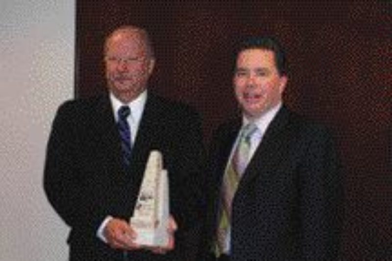 HONOURED: Ted Stoner presents Barry Bembridge with safety award.