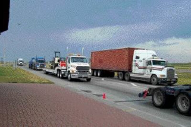 HUNGRY?: Getting stopped at the Balzac weight scale wasn't all bad on Aug. 9, as the AMTA and inspection officers served up breakfast.