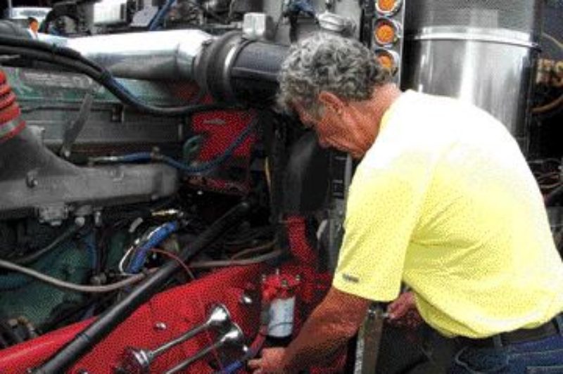 EXCITING EXPERIMENT: Mark Brander of Core Energy installs the Diesel Fuel Exciter on a truck at the Fergus Truck Show.