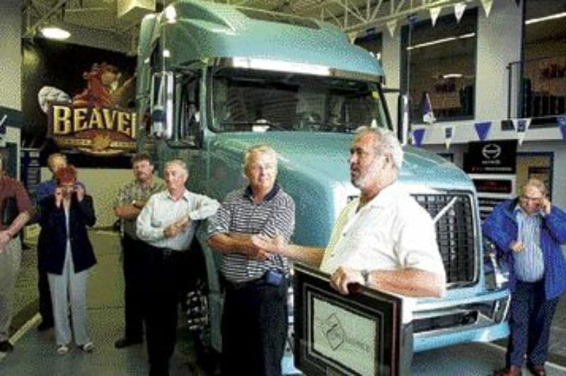 CREAM OF THE CROP: Tom Petch, fleet manager with Volvo Trucks Canada, presents the award to Barry Searcy, president of Beaver Truck Centre.