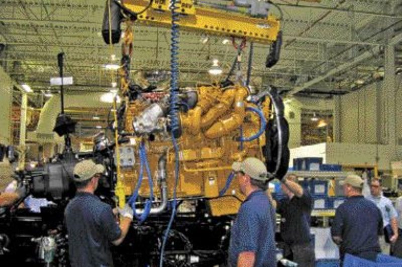FIRST OF ITS KIND: Workers at Kenworth's Chillicothe assembly plant build the first Kenworth T660, equipped with a Cat C15 engine.