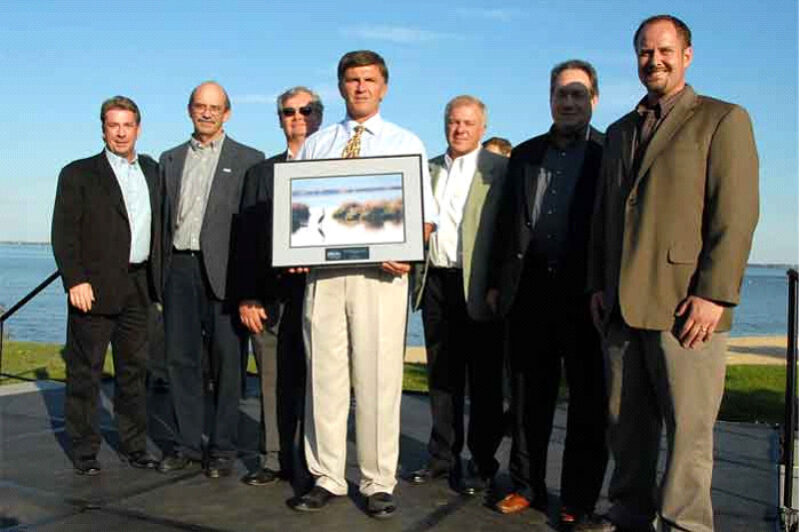 Volvo Powertrain North America representatives receive environmental award from Maryland Gov. Robert Ehrlich, Jr. (holding award).  From left, Scott Morris, Robert Phelps, Tom Kriner, Gov. Ehrlich, Ingvar Tagert, Denny Hollinger and Dave Smith.
