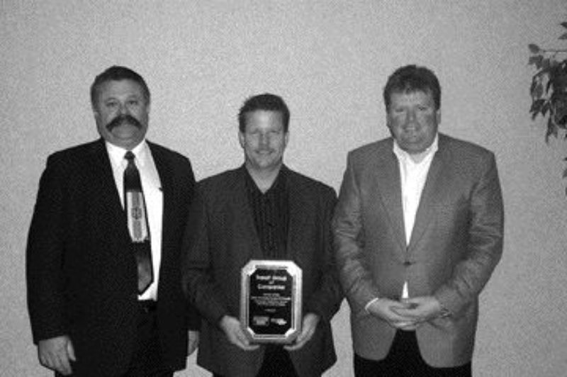 TOPS FOR TRANSX: TransX Group of Companies was awarded the 2006 OTR/SelecTrucks of Canada Canadian Retention Award in the Over 100 Power Units category. Pictured left to right are Nevio Turchet of SelecTrucks, and Dave Waver and Mike Jones of TransX.