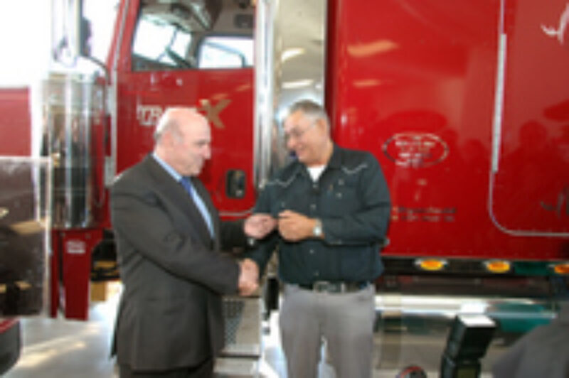 TransX president Louis Tolaini presents the company's longest serving driver Joe Nayanokee with the keys to his new 2007 Peterbilt.
