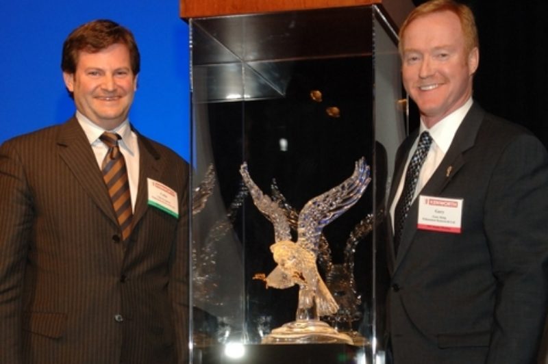 Edmonton Kenworth executives, Collin Ferguson and Gary M. King, with the 2006 Kenworth Dealer of the Year award.