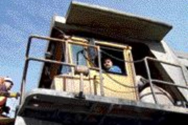 HIGH IN THE SADDLE: Driving the mine trucks can be intimidating at first, due to their size.Photo by Steven Macleod