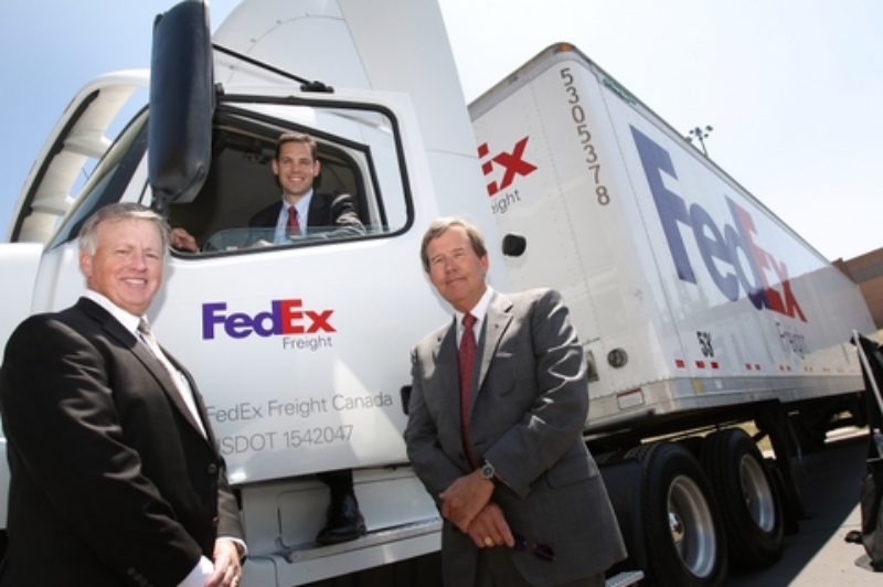 Larry Miller, president and CEO, FedEx Freight East (left), and Doug Duncan, president and CEO, FedEx Freight (right), join Grant Crawford, vice-president/general manager, FedEx Freight Canada (centre), to unveil FedEx Freight Canada's new national headquarters and service centre in Toronto.