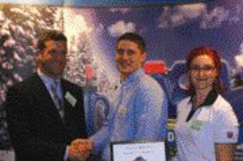 TOP TECHNICIAN: Technician of the Year Calum Robson is flanked by Chevron's Chris Leitch and Ginny Desaulniers.