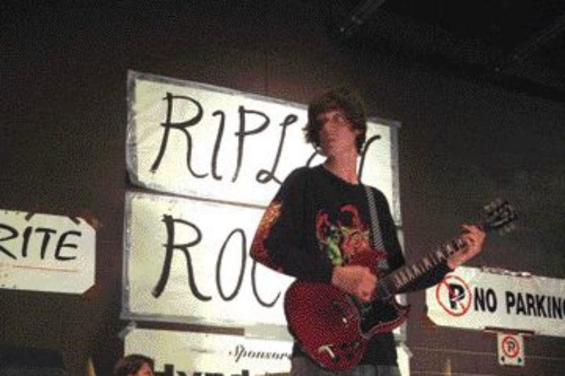 ROCKIN' IN RIPLEY: Tom Russell (left) gets rocking with Michael Wilkins (centre) and his son, Spencer, at a recent charity concert at Ripley-Huron Community School. Though a trucker by trade, Russell is a rocker at heart, having worked with more than 30 students at the school to help develop their musical talents for the show. Photo by Adam Ledlow