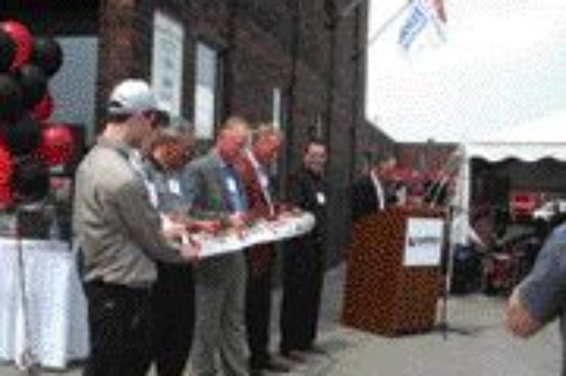 NEW LOOK: Harper Power Products executives cut the ribbon at a revamped company headquarters.