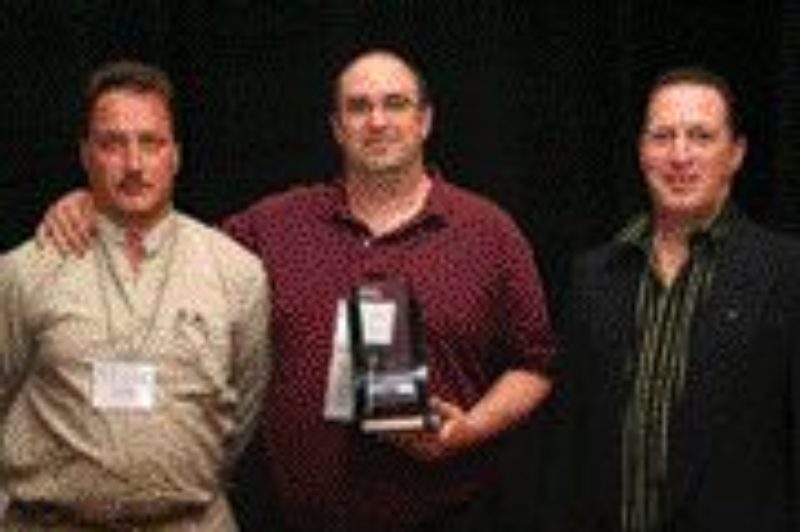 TDL TOPS: Mark Mostacci (left) and Paul Pierce of TDL Group receive their award from David Sheepway of sponsor Zurich.