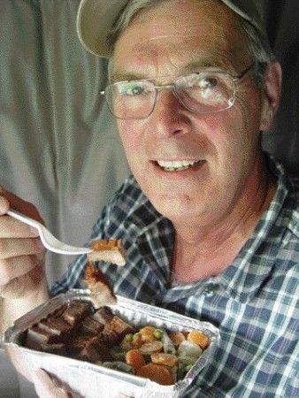 RECIPE FOR SUCCESS: Bernie Oikle enjoys a home-cooked meal prepared by his wife Joyce. Oikle's diet has helped him lose 27 lbs and he maintains the weight loss by bringing healthy meals with him on trips.