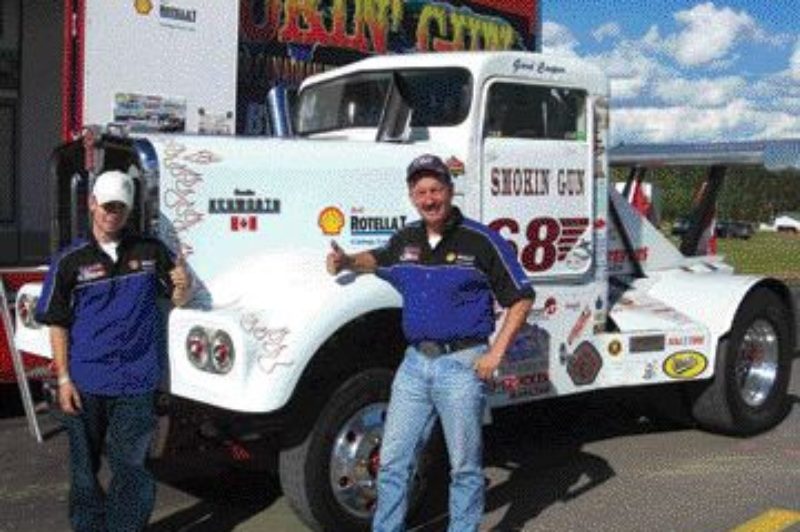 NEW RECORD: Gord Cooper and son Matt pose for pictures just days after smashing the previous big rig speed record.Photo by Steven Macleod