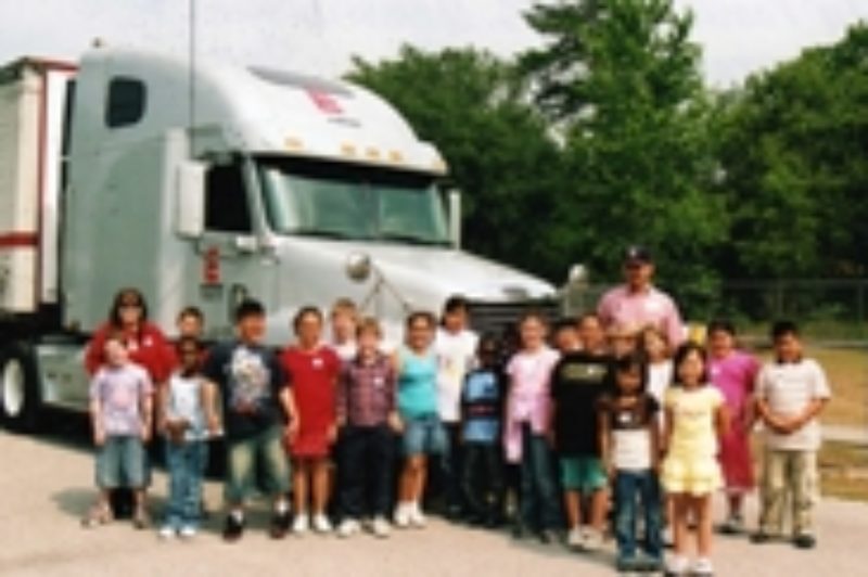 Andrew Pomicter, December's Trucker Buddy of the Month, poses with Christina Demonbreun's elementary school class.