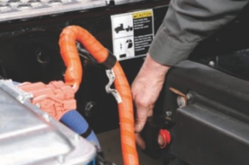 UNIVERSAL LANGUAGE: High-voltage wires on hybrid systems are coloured bright orange and thickly insulated to protect maintenance personnel.