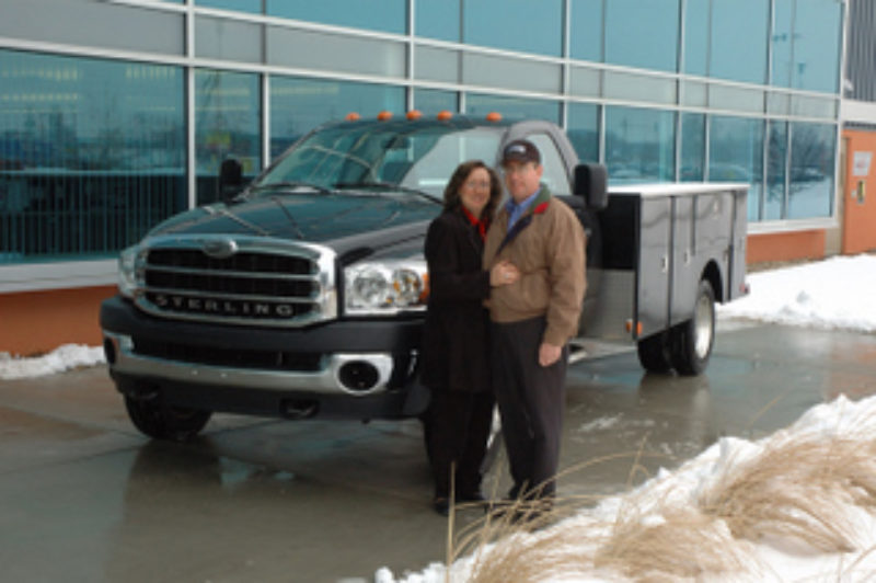 Randy and Rhondia Lightner pose with a Sterling Bullet. The landscapers won a brand new Bullet through a random draw.