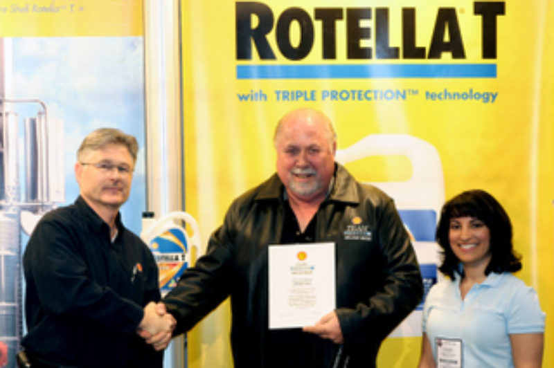 John Redwood is congratulated for becoming the latest member of the Haul of Fame by Shell officials at Truck World.