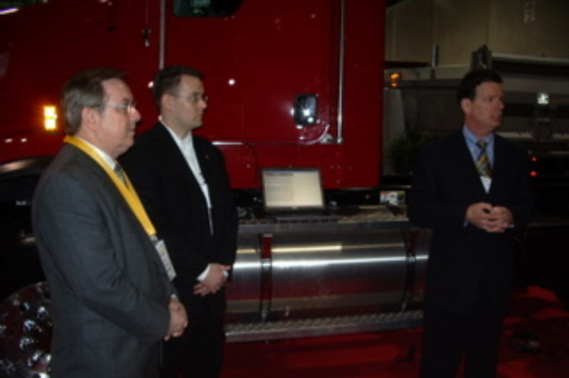 Transport Minister Jim Bradley (left) is pictured with Cummins' Adam Whitney and OTA president David Bradley (right) during a demonstration at Truck World.