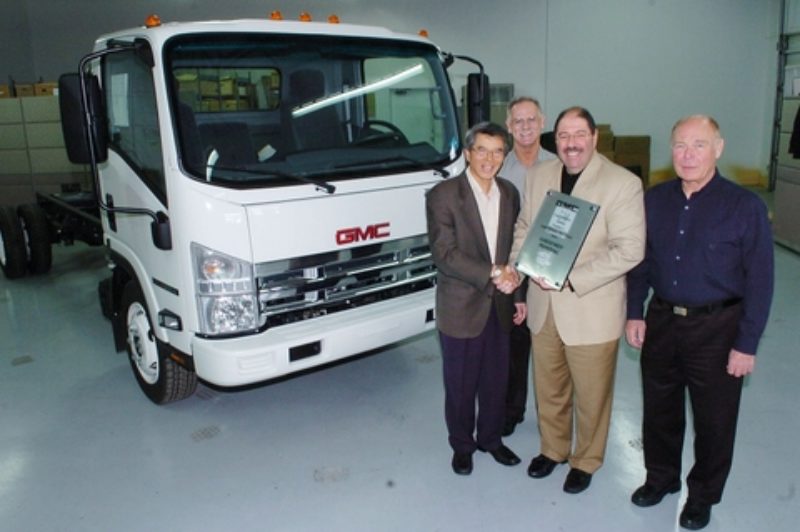 Pictured from left to right are: Bill Sie, dealer principal, Gold Key GMC Commercial Truck Centre, Langley, B.C.; Martin Armstrong, commercial truck sales manager for GM Canada; Joe Aiello, national commercial truck sales manager for GM Canada; and Jim Alden, sales manager west, Isuzu.