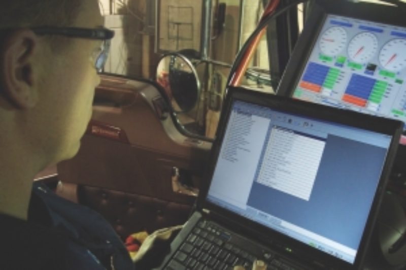 TAMPER PROOF?: Matt Koski of Toromont Cat programs the speed limiter of a truck at 105 km/h.