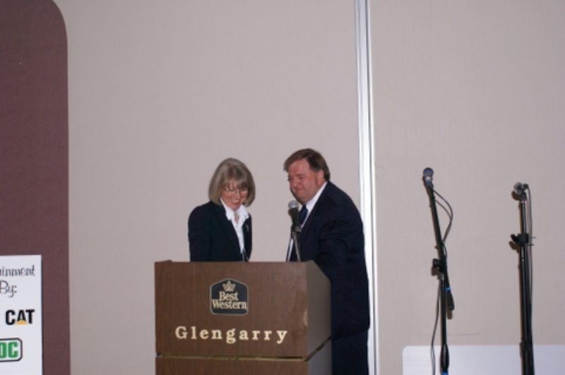 TANS chairman Bill Dowe presents Brenda Putnam, chairperson of Early Intervention Nova Scotia, with monies raised for the charity during the association's annual conference in Truro.