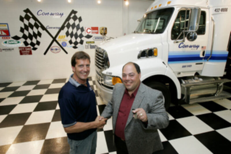 Handing over the keys to the Sterling truck is Brad Davis to Mike Grima. (Photo by David Chidley)