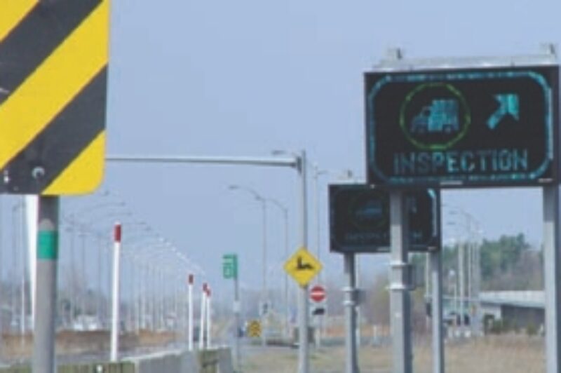 INTELLIGENT BORDER: Electronic signboards inform a driver to report in for inspection.