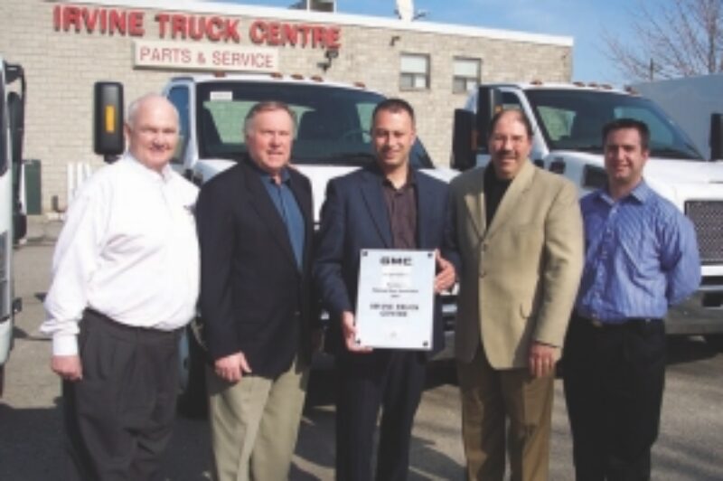 TOPS IN MEDIUM-DUTY SALES: Pictured from left to right are: Frank Gallagher, commercial truck sales manager, Ontario region and Atlantic; Russ White, Irvine truck sales representative; Mike Mintsopoulos, Irvine general manager; Joe Aiello, national manager, GM commercial truck sales and field operations; and Manny Caruso, Irvine new truck sales manager.
