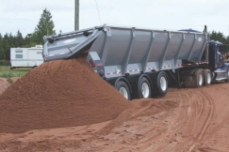 OUT THE BACK: Uneven terrain such as this is ideal for live bottom trailers, which don't require the driver to raise the box and risk a rollover.
