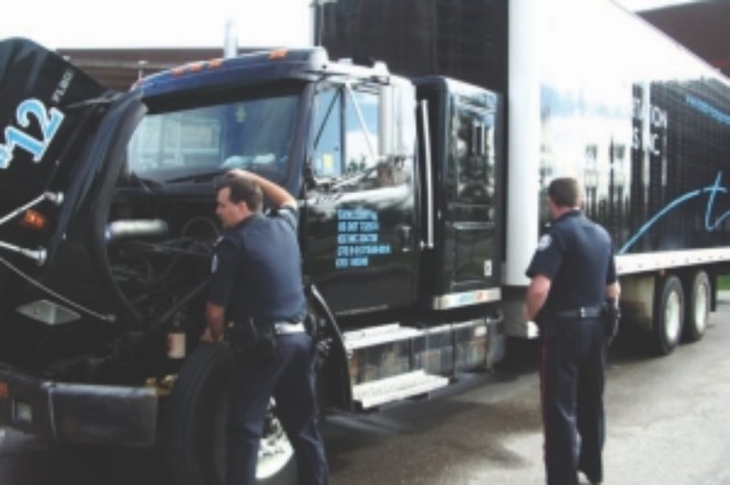 HIDE AND SEEK: Sgt. Rob Whalen hides fake contraband on this Total Transportation Solutions truck as part of a training exercise.