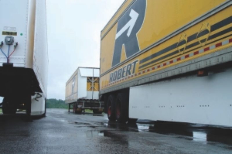 READY TO ROLL: Two types of trailer skirts and a TrailerTail wait for sun and their turn on the track during the recent EnergoTest.